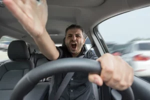 Angry man driving a vehicle